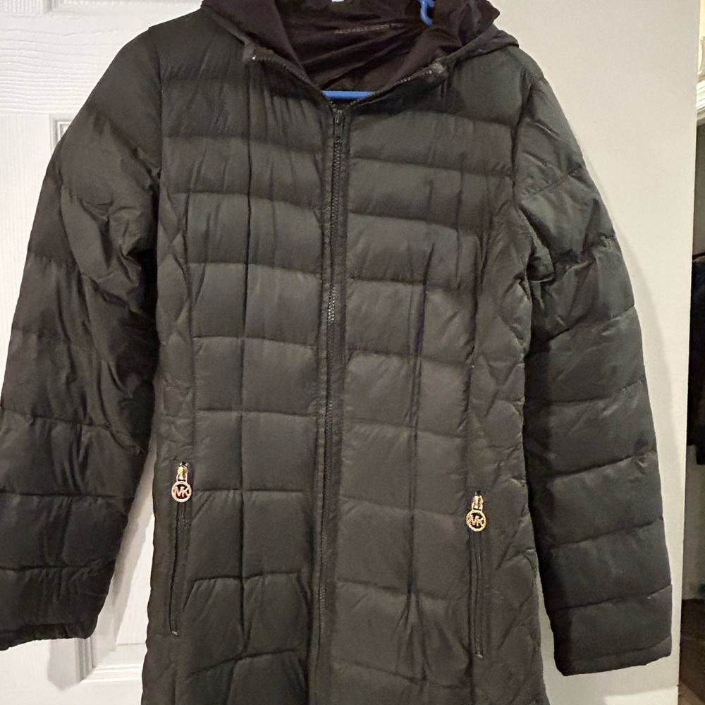 Michael Korrs Army green, feather down coat. I loved this coat. Light weight!